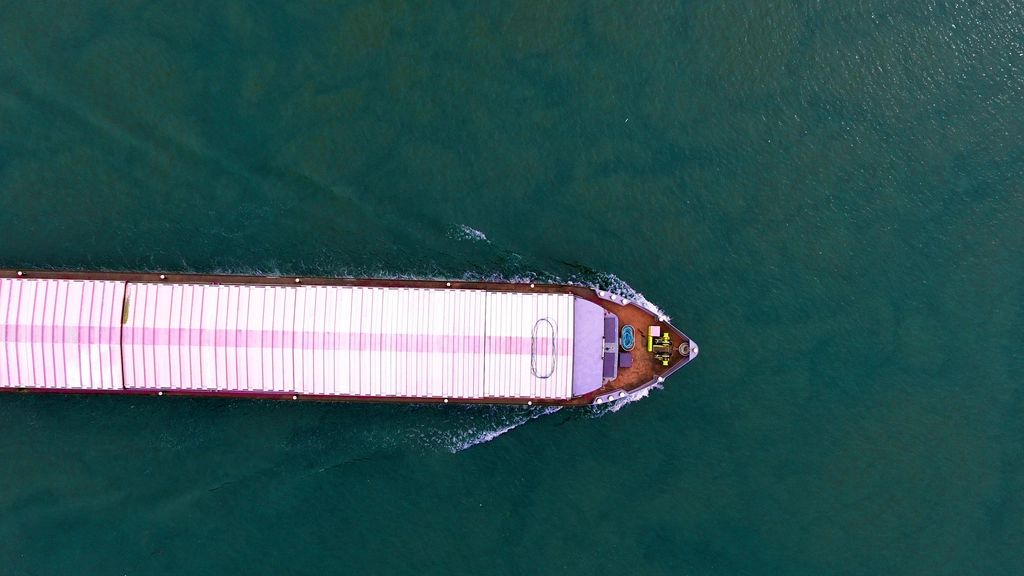 Cargo ship seen from above on open water